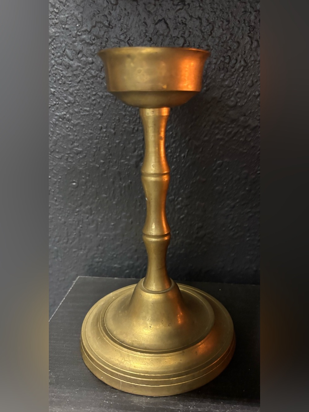 Brass Candle Holder classic baluster-style stem and a stepped round base.